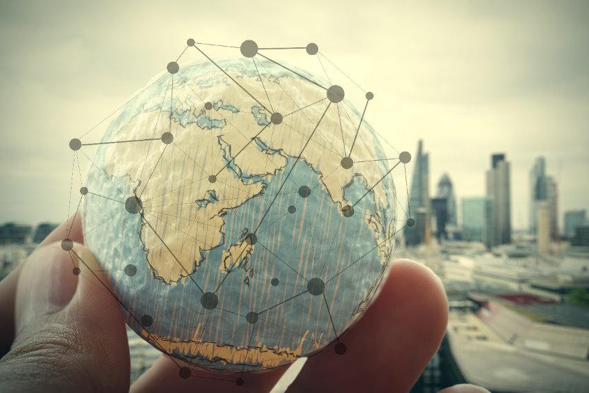 Close up of businessman hand showing texture the world with digital social media network diagram concept