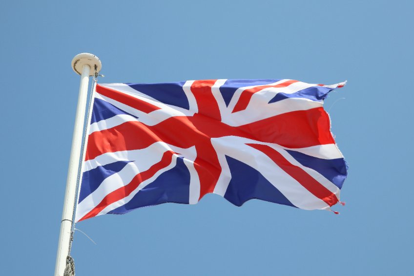 uk flag british on a mat in the wind and blue sky