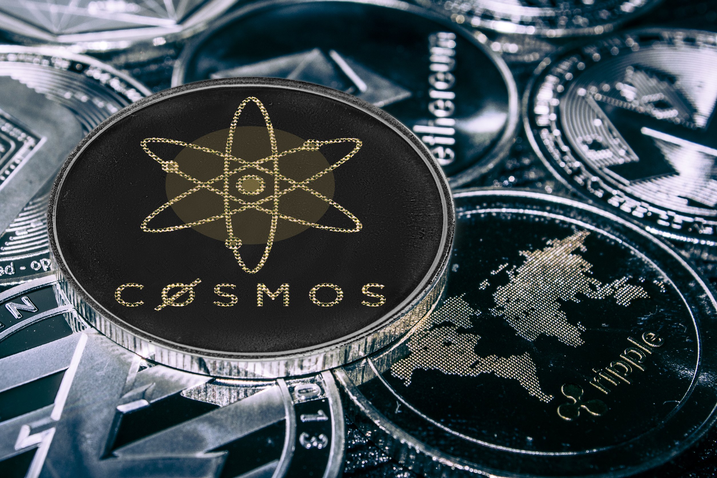 Cosmos Atom Coin on a stack of other coins representing the interconnectedness of various chains.