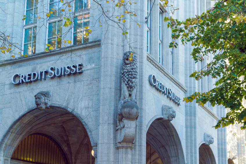 Stone, grey building of banking giant Credit Suisse located in Switzerland.