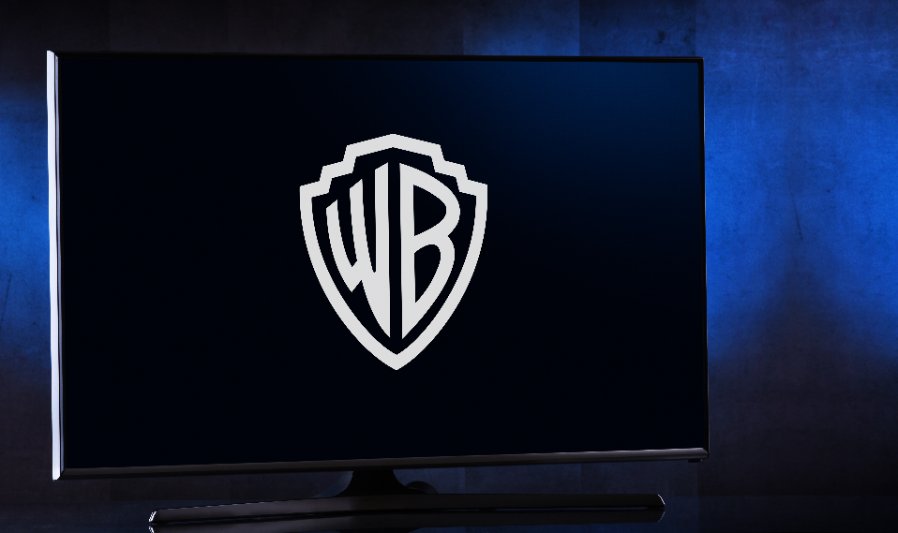 Flat-screen TV set displaying logo of Warner Bros.