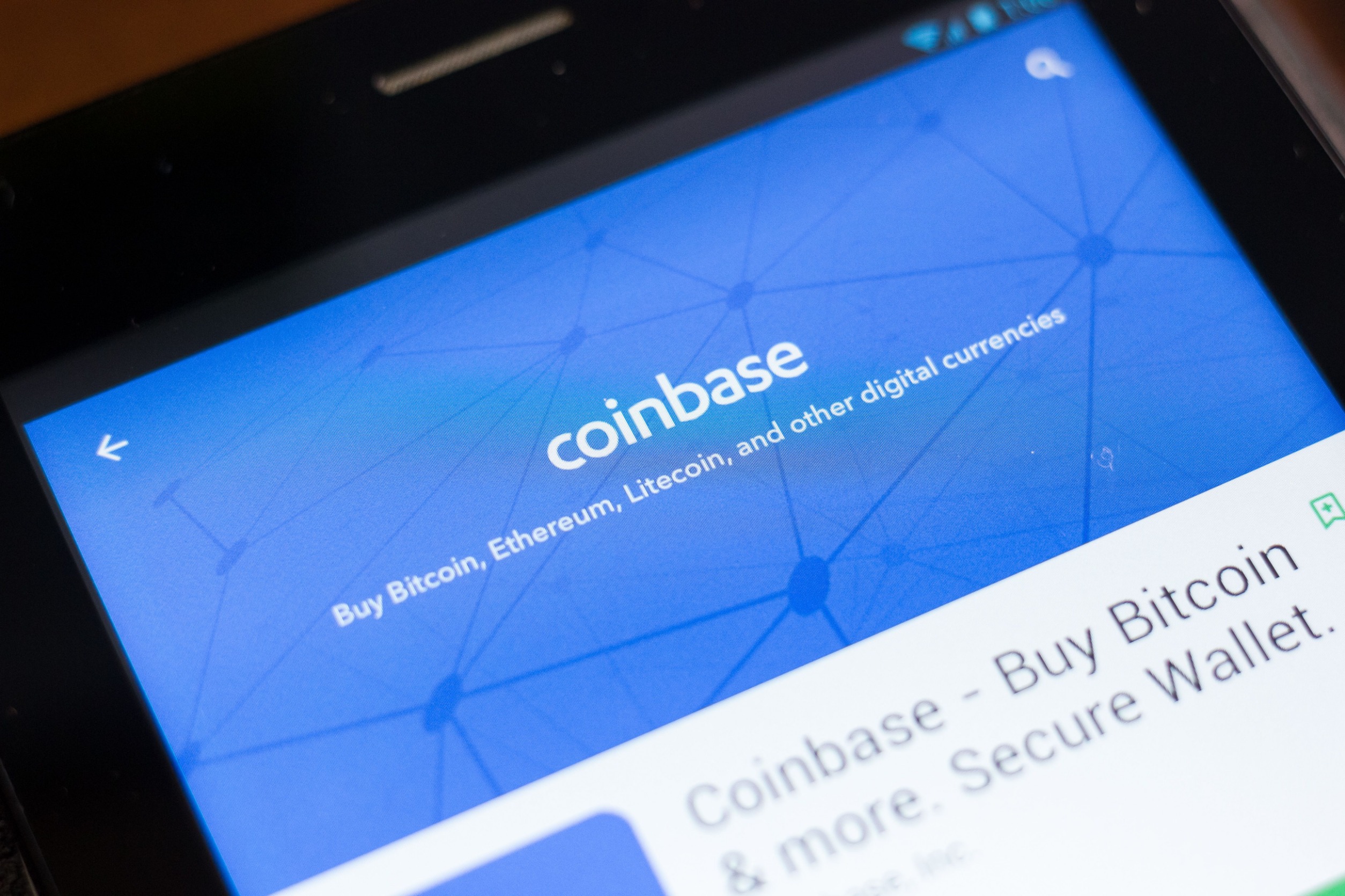 Coinbase logo on a screen