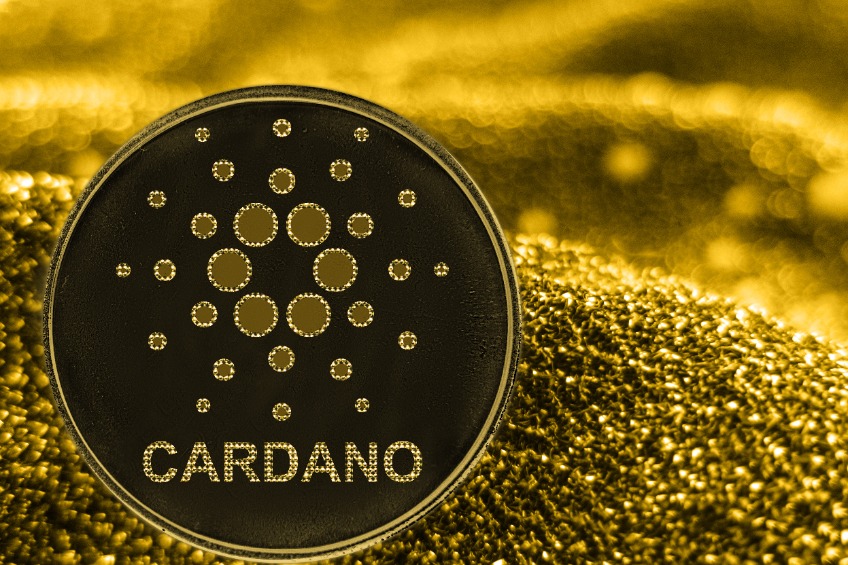 Coin cryptocurrency Cardano and gold fabric background. ADA