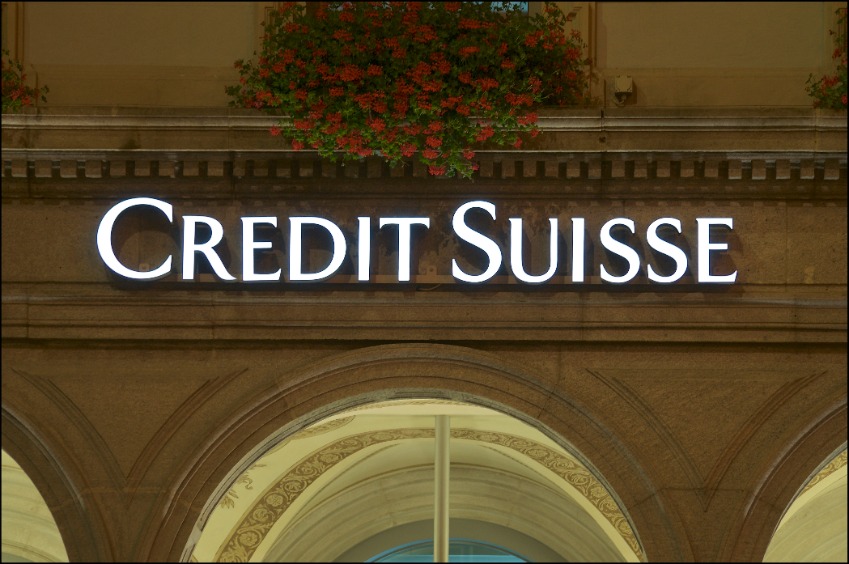 Front view of the Credit Suisse Bank logo hanging in front of the building in the city of Lugano