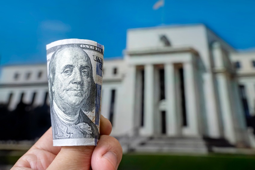 a hundred-dollar bill on the background central bank