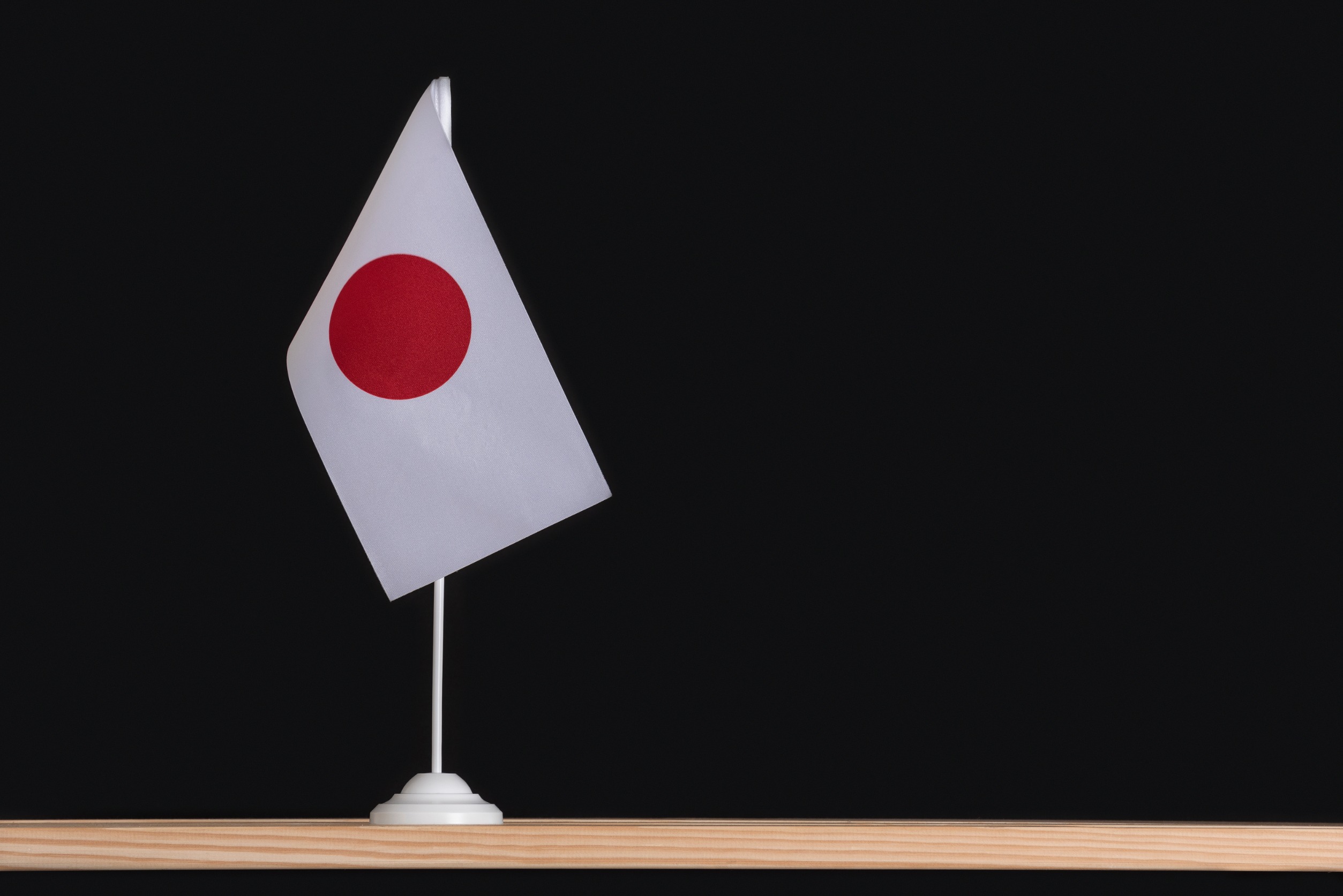 Little Japanese flag on a desk.