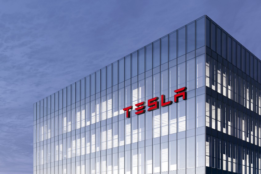 Tesla Signage Logo on Top of Glass Building.