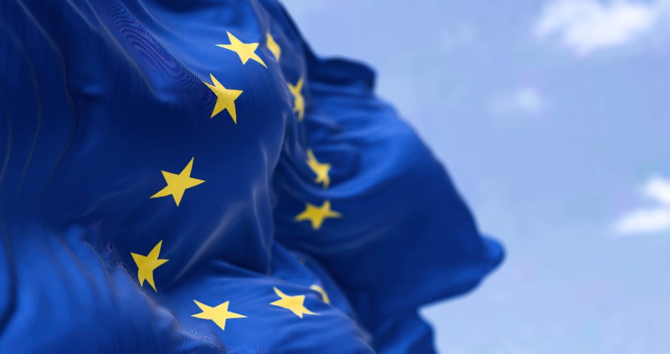 The flag of The European Union flapping in the wind. Economic and finance Community.