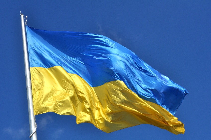 Flag of Ukraine against a plain blue sky