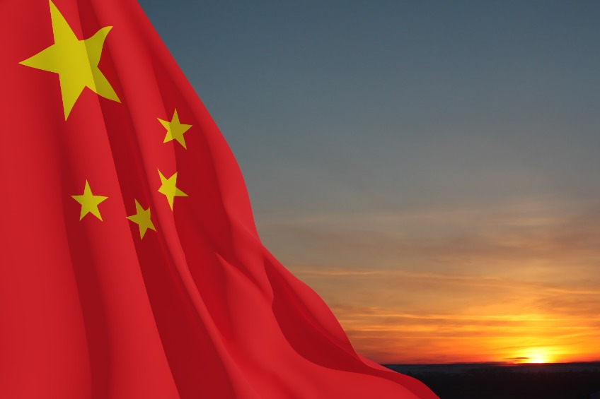 Close up waving flag of China on background of sunset sky. 3d rendering.