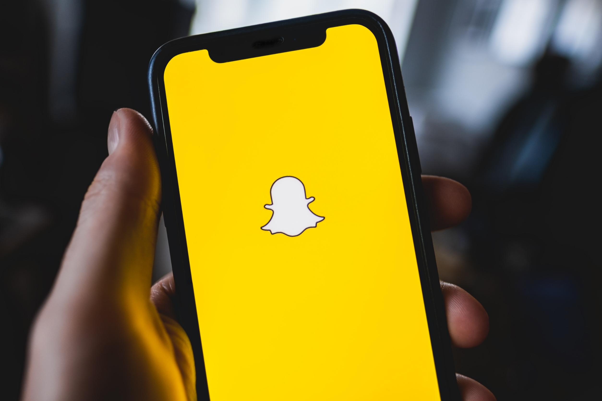 Snapchat logo on a phone screen