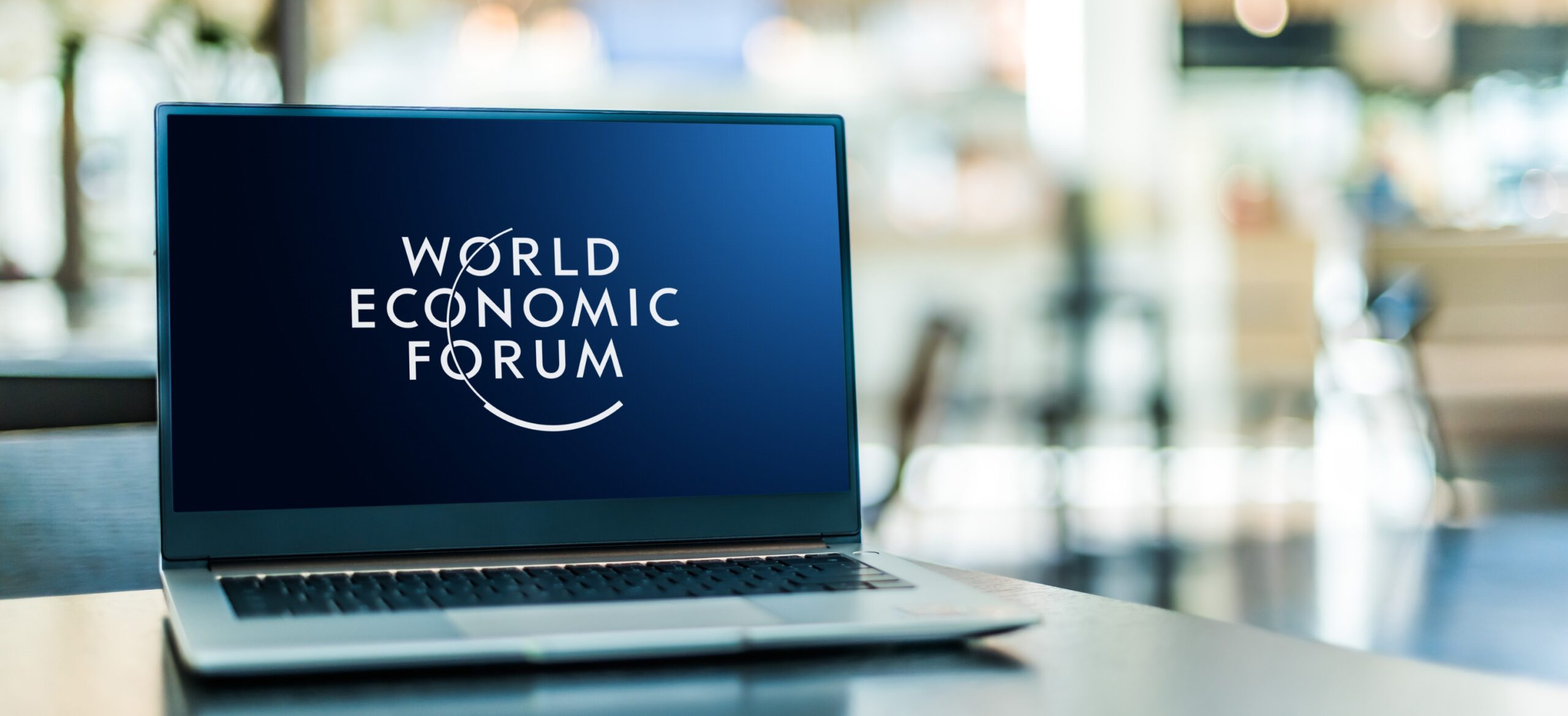 Laptop computer displaying logo of The World Economic Forum, an international NGO based in Cologny, Geneva Canton, Switzerland and founded on 1971