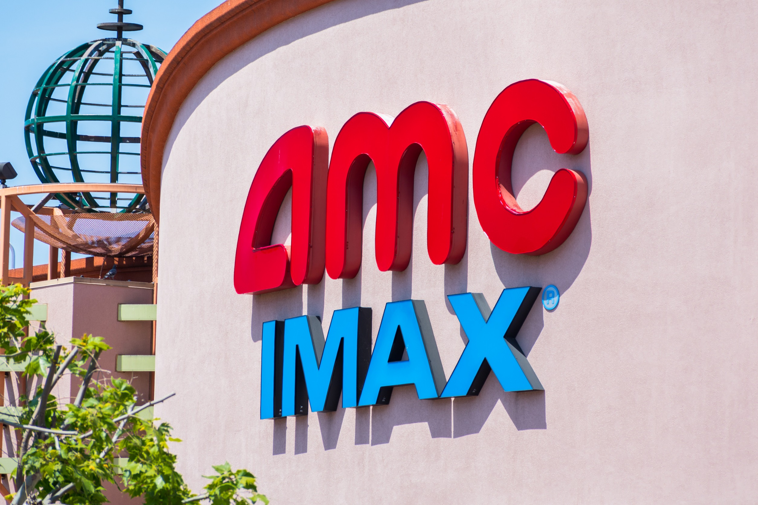 Building with "AMC IMAX" written on its side.