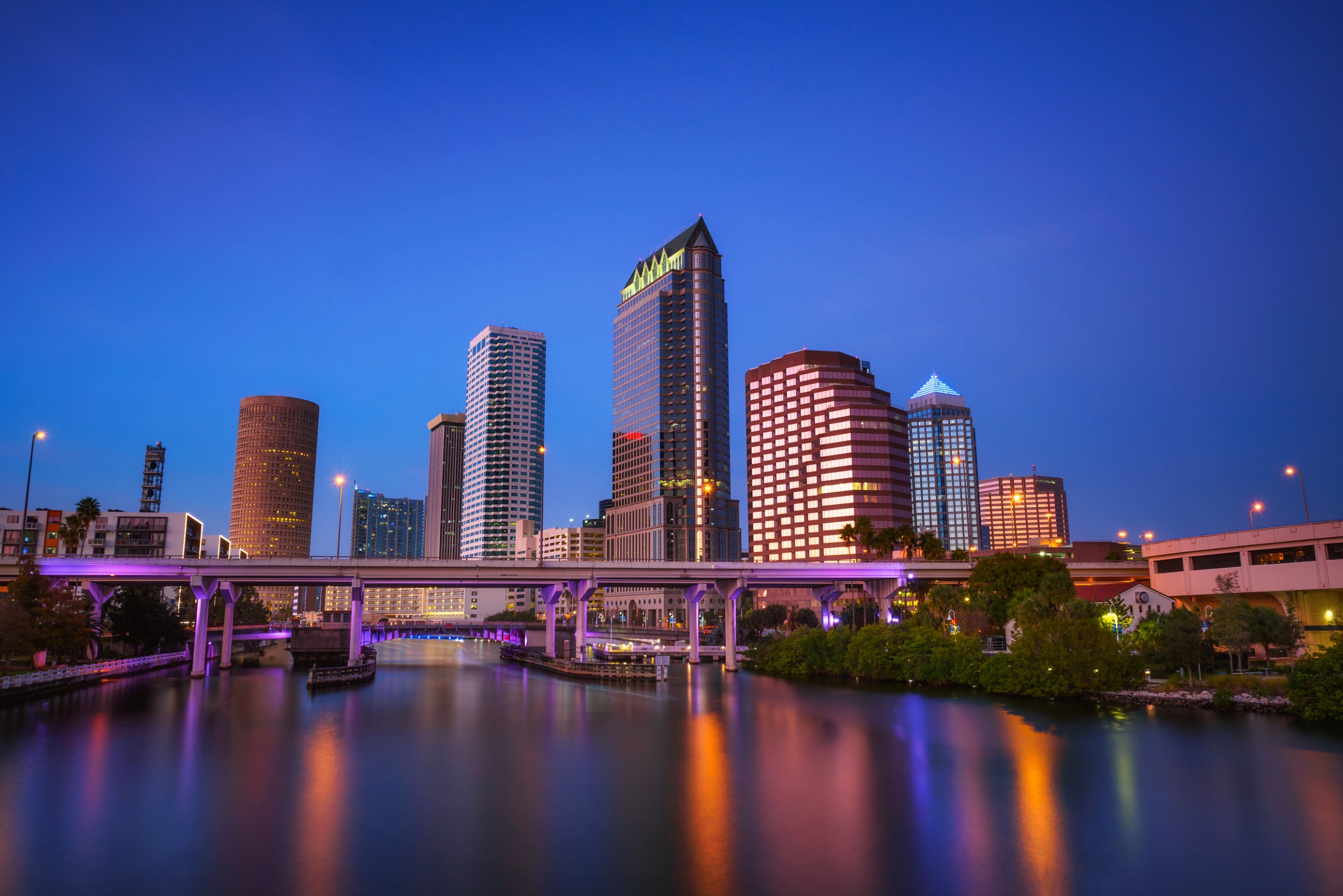 Tampa skyline after sunset with Hillsborough river in the foreground