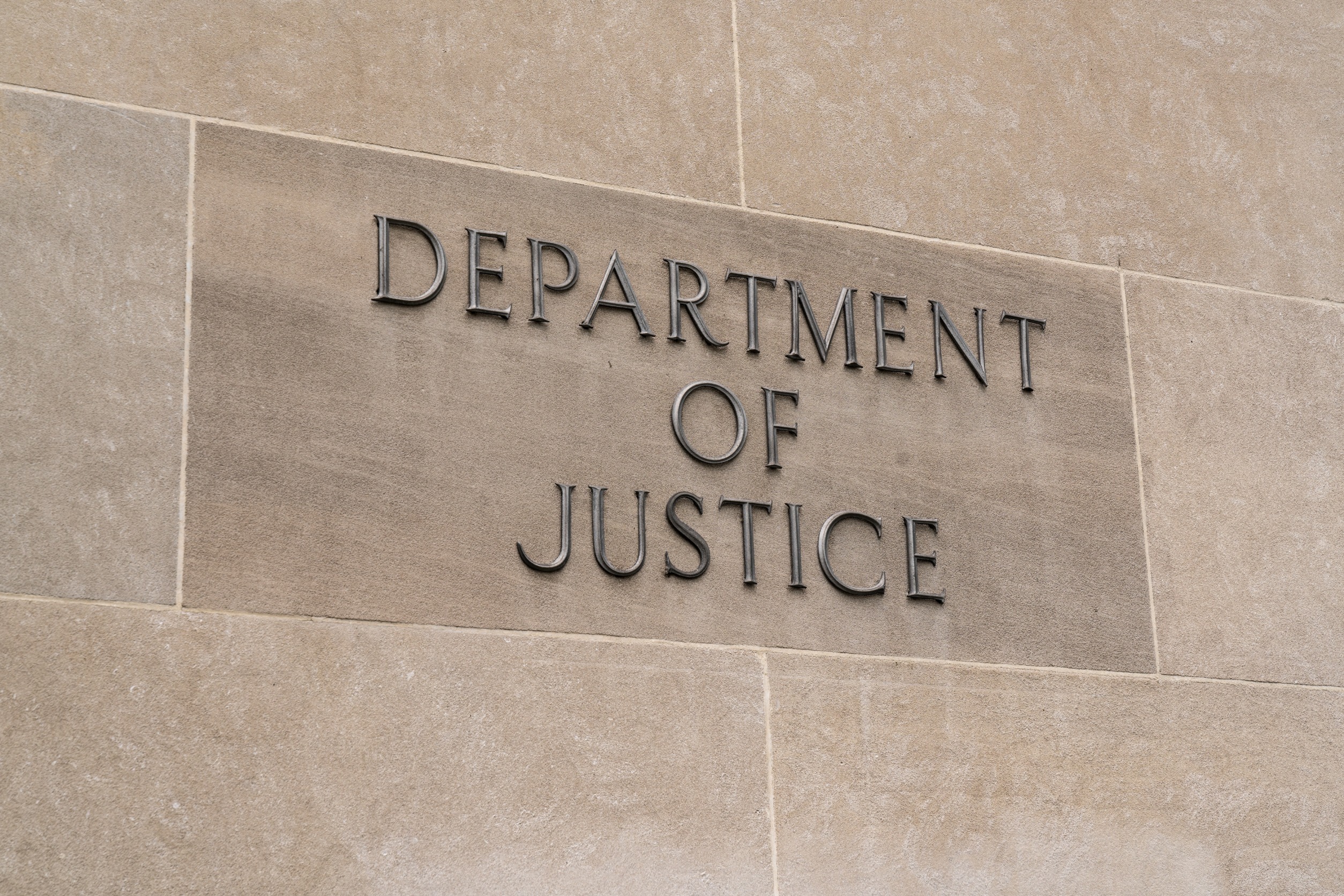 "Department of Justice" on the wall of a building