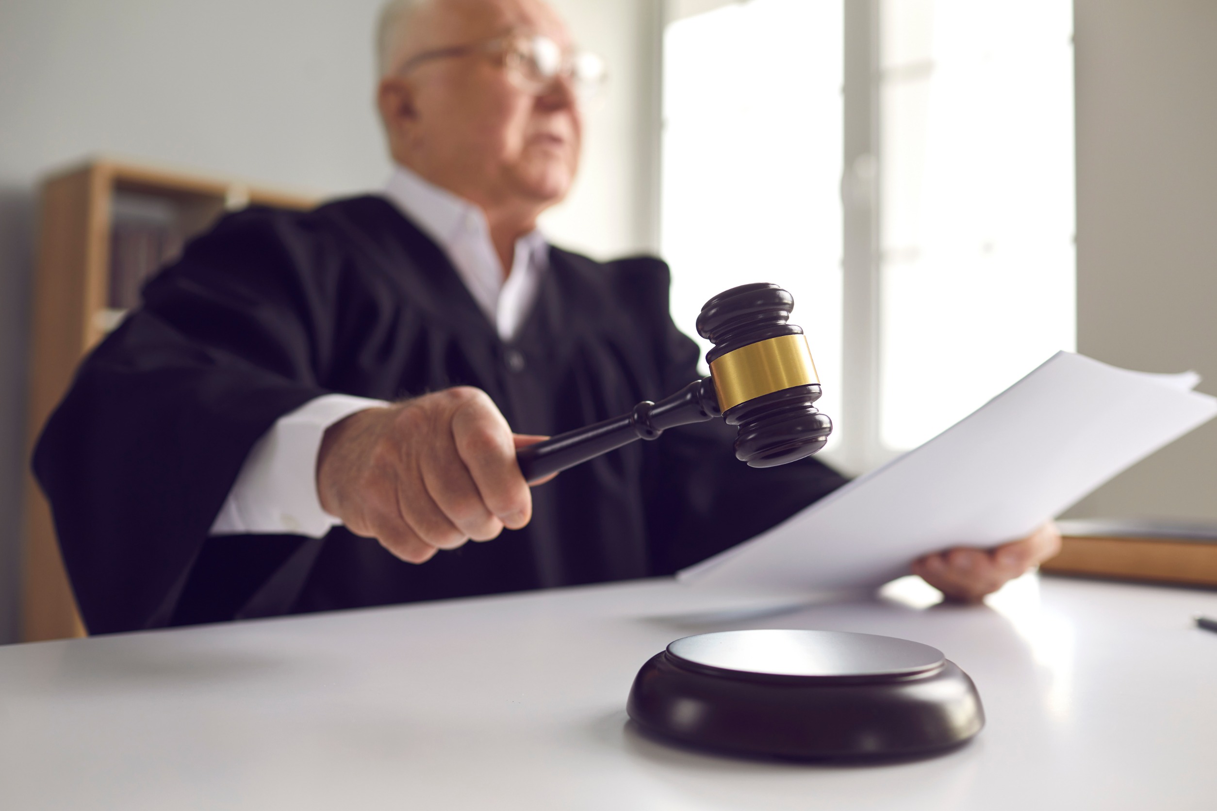 Judge with a hammer from a low angle