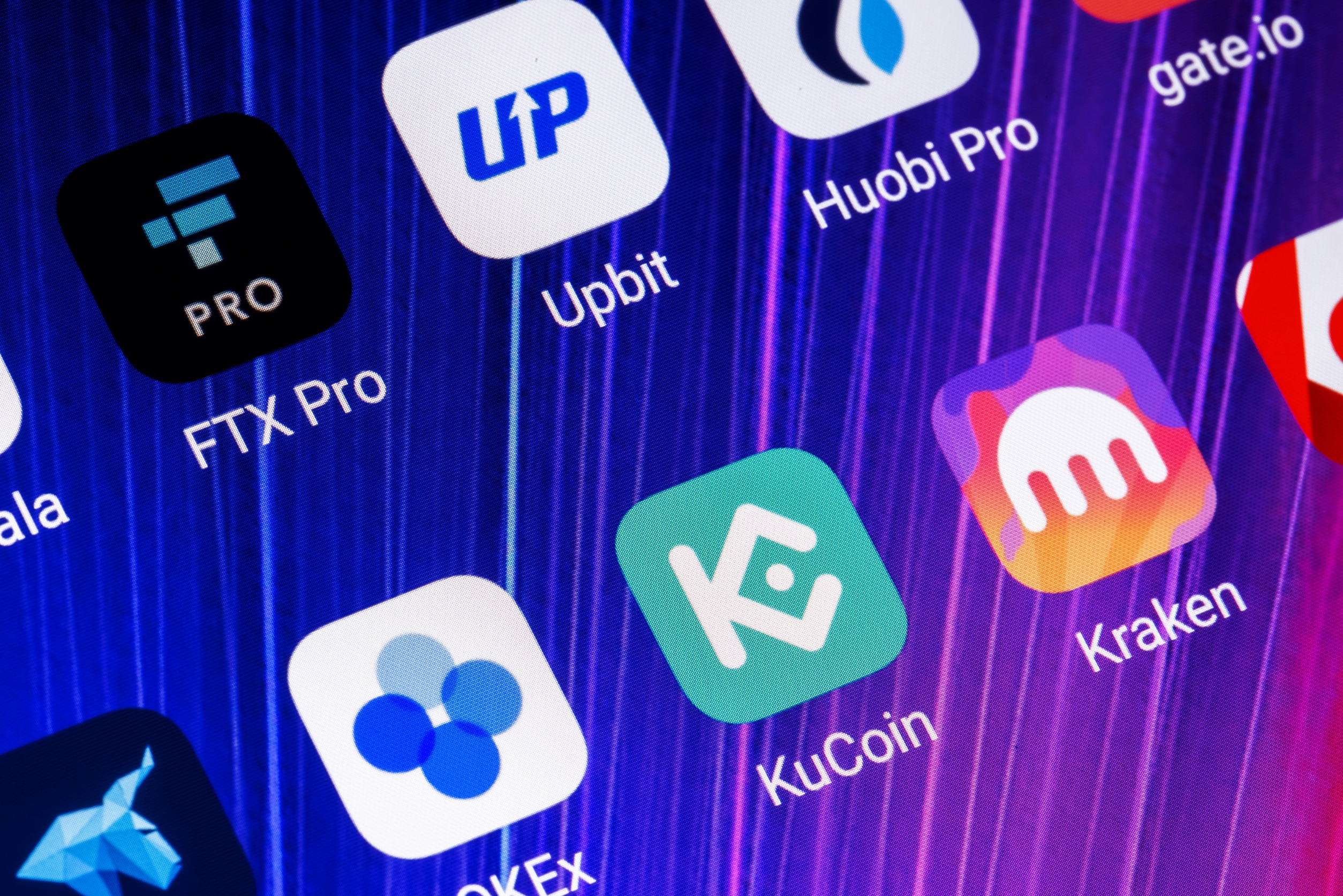 A bunch of cryptocurrency apps on a neutral background