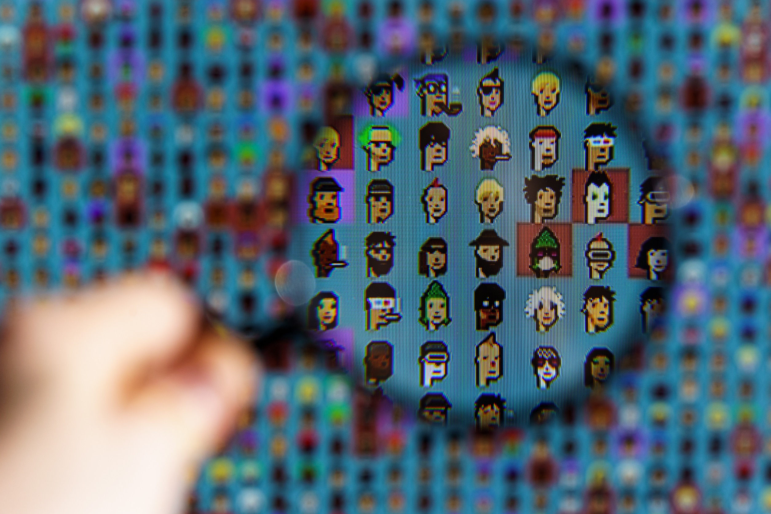 A lot of NFTs under a magnifying glass.