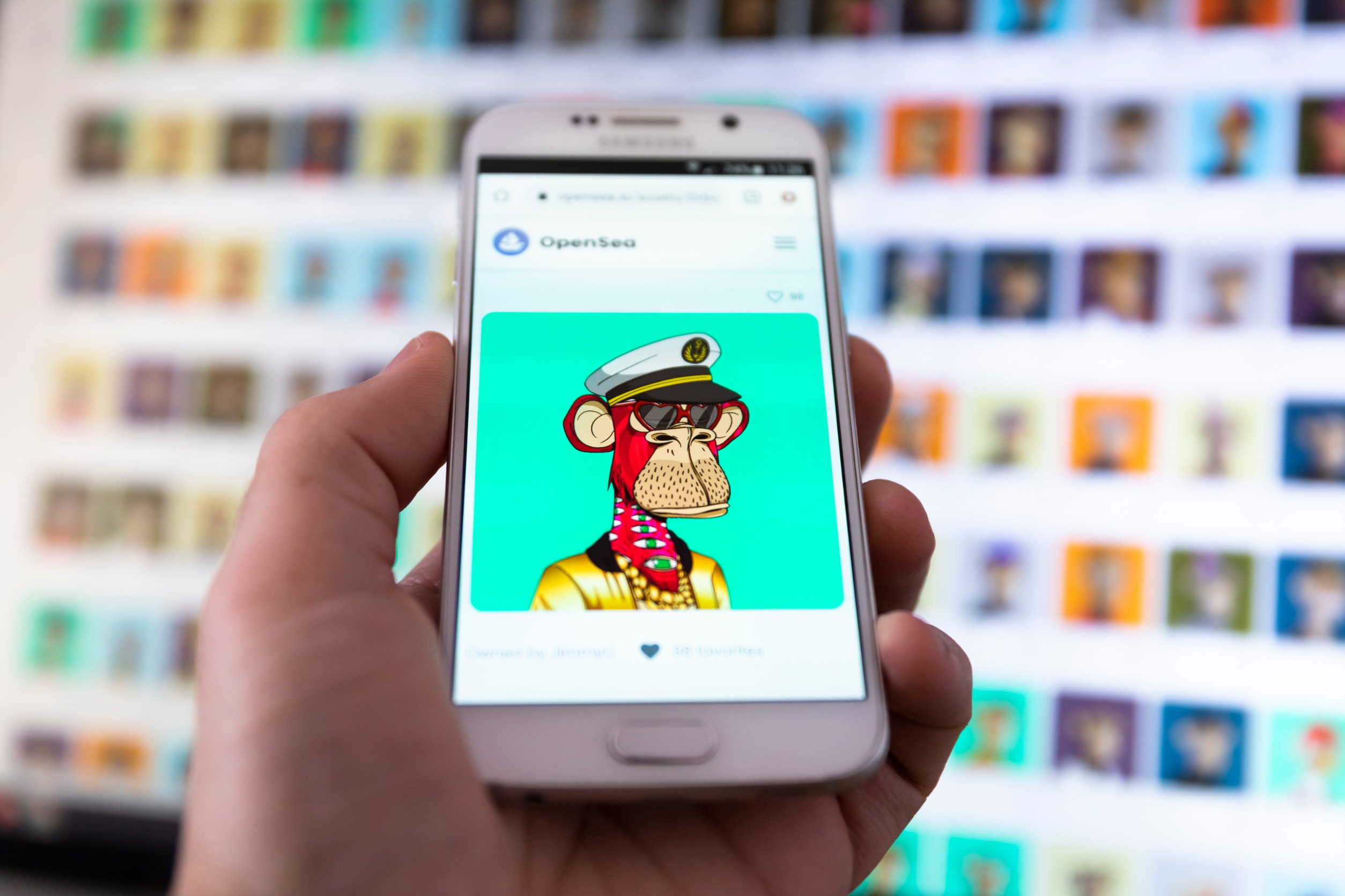 The most expensive Bored Ape NFT from Yacht Club NFT collection (BAYC) on smartphone screen. Trading at Opensea marketplace. Non fungible token on blockchain