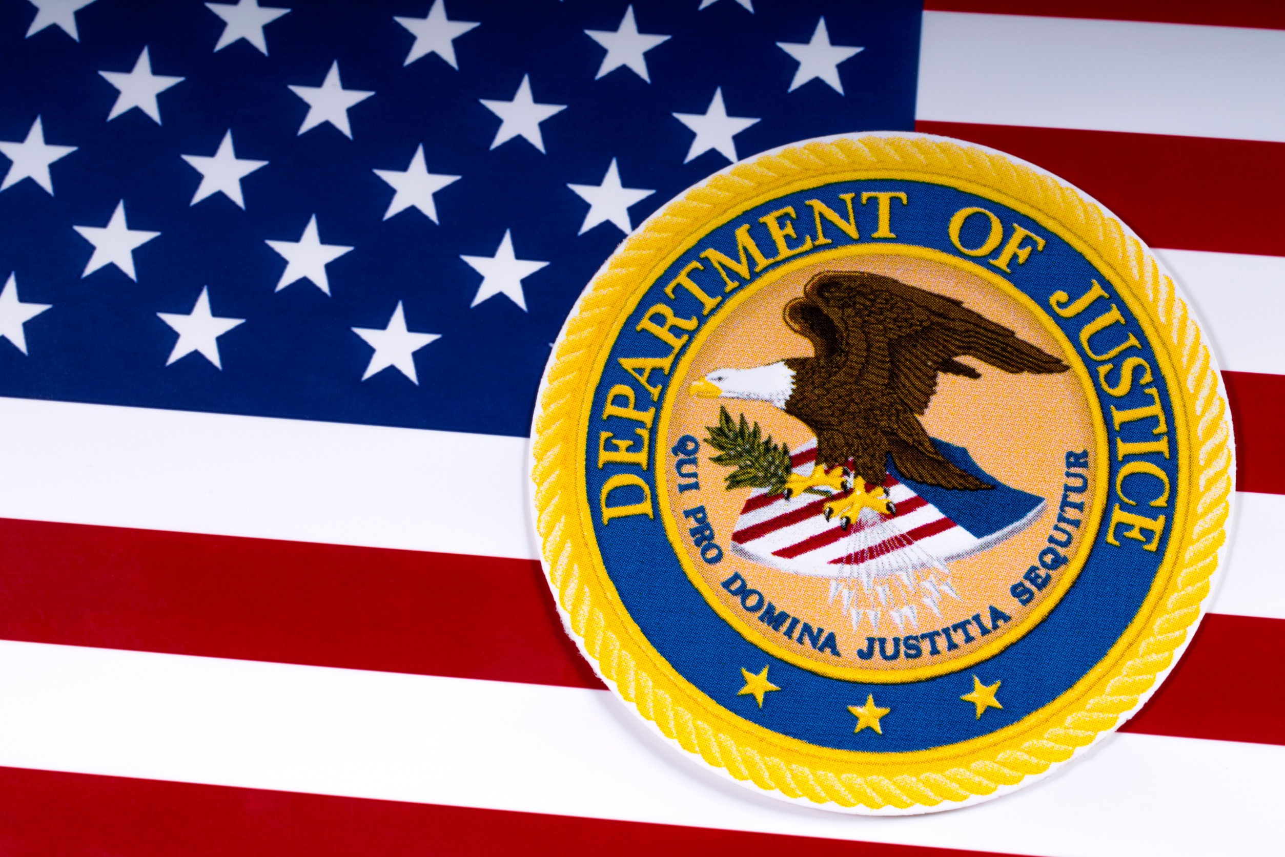 American flag with a DoJ seal on it.