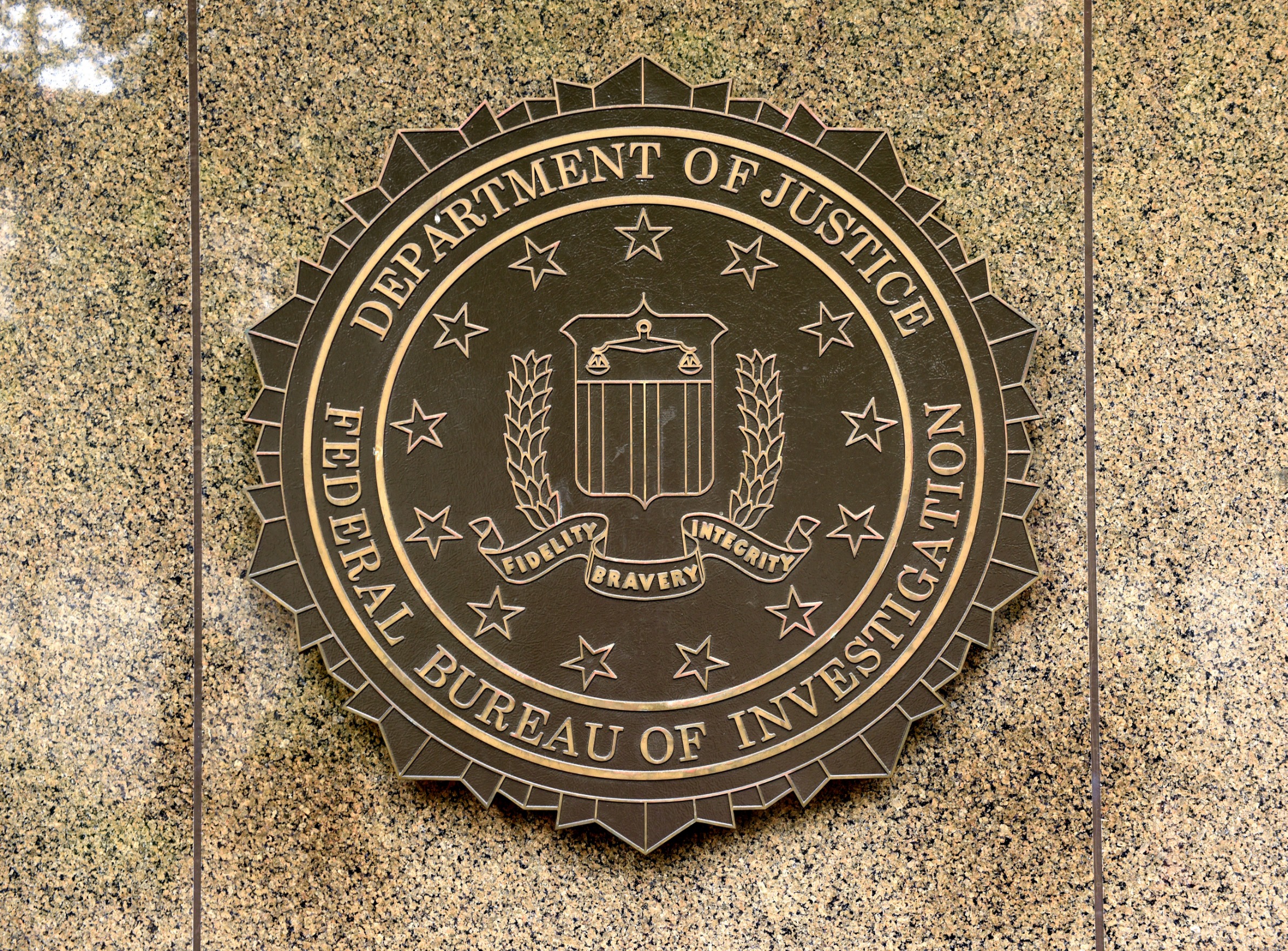 FBI seal on the wall of a building.