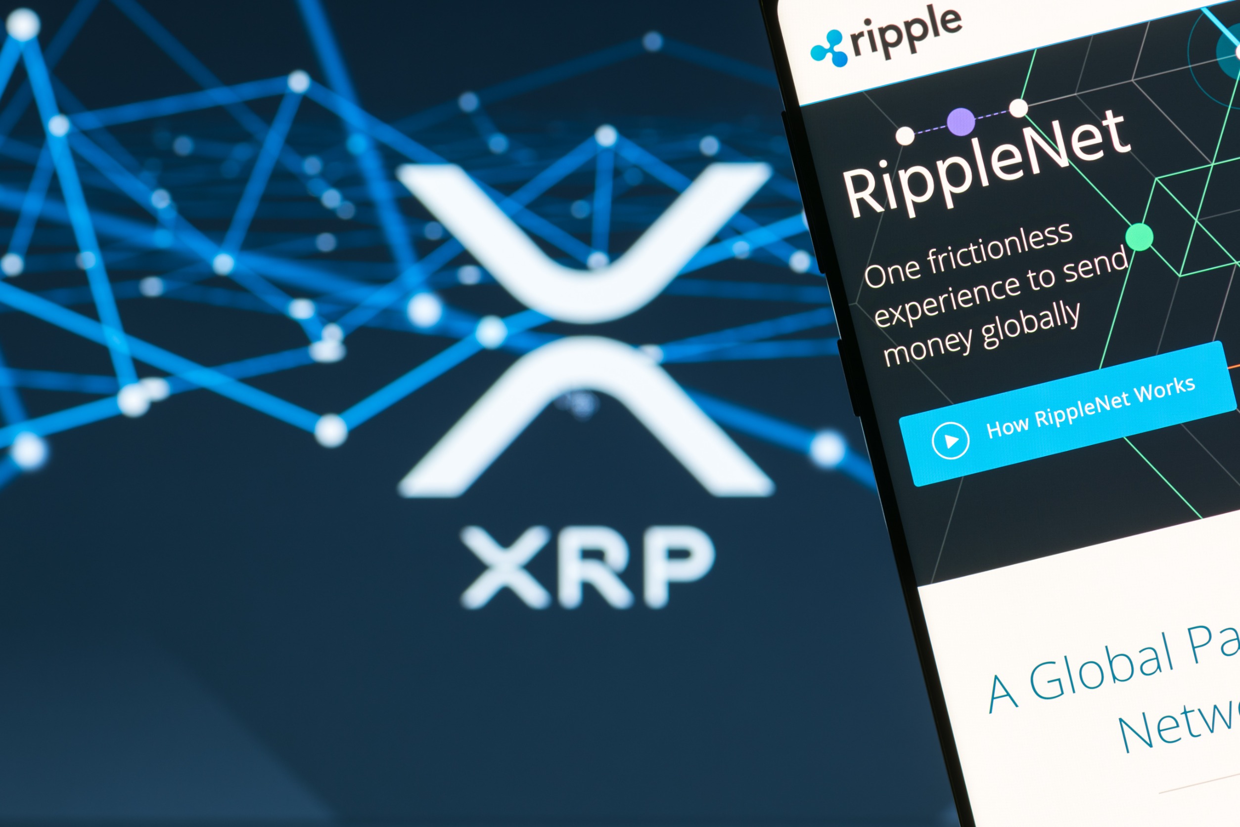 Ripple (XRP) website on the smartphone display. Ripple is a cryptocurrency and remittance network.