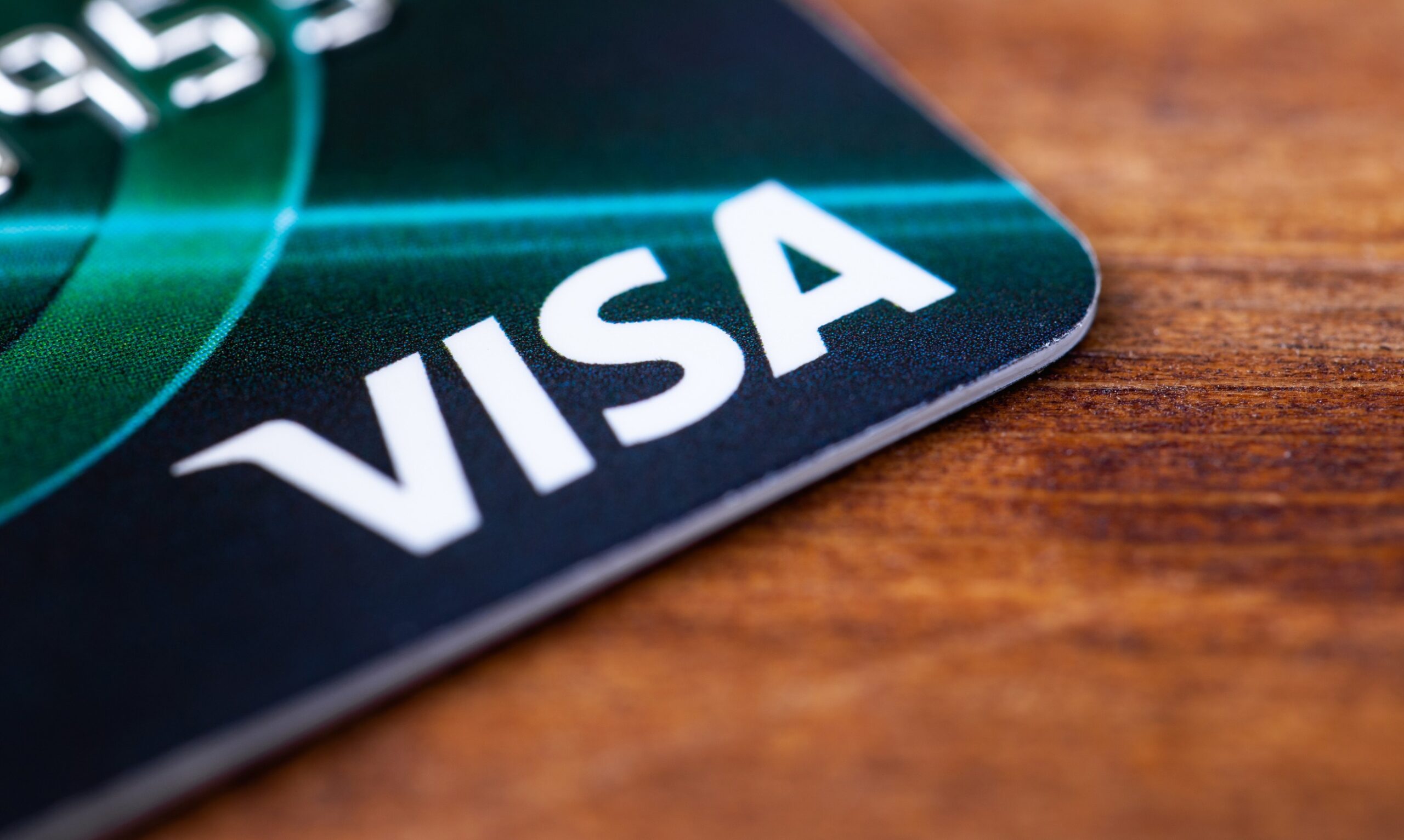 A Visa card on a desk.