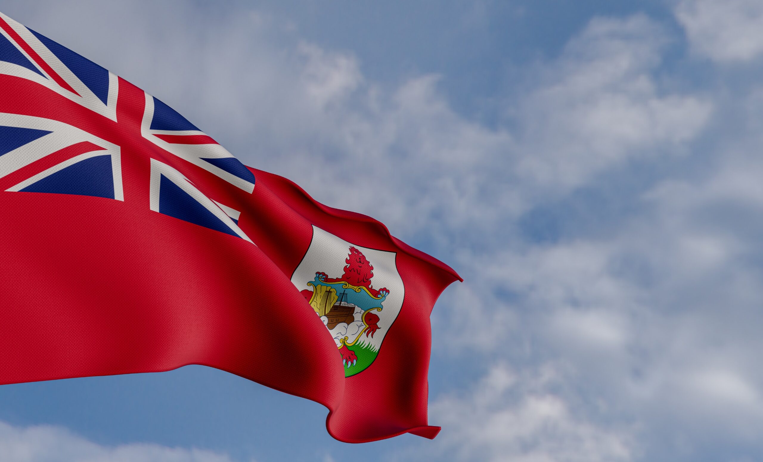 Bermuda flag against a blue sky.