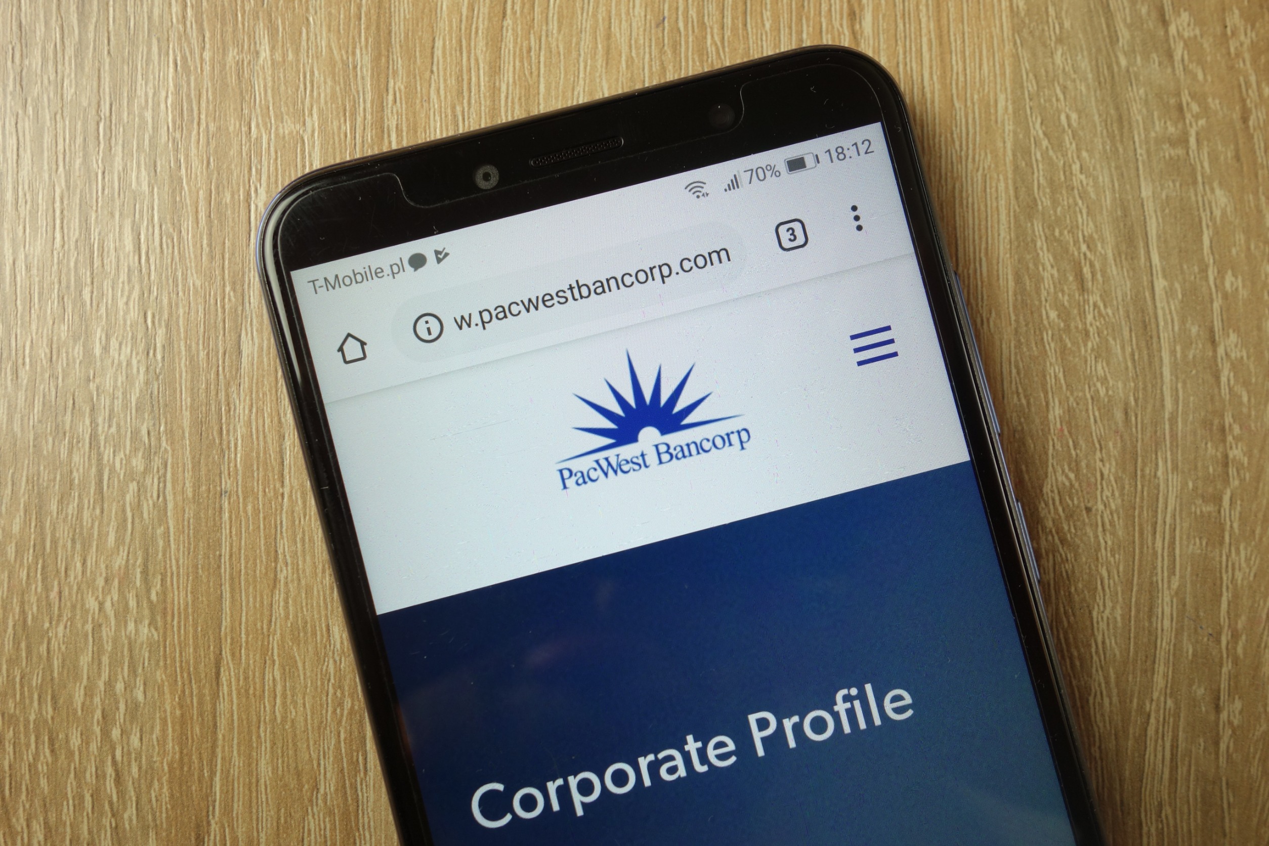 A smartphone displaying a page on PacWest's website.