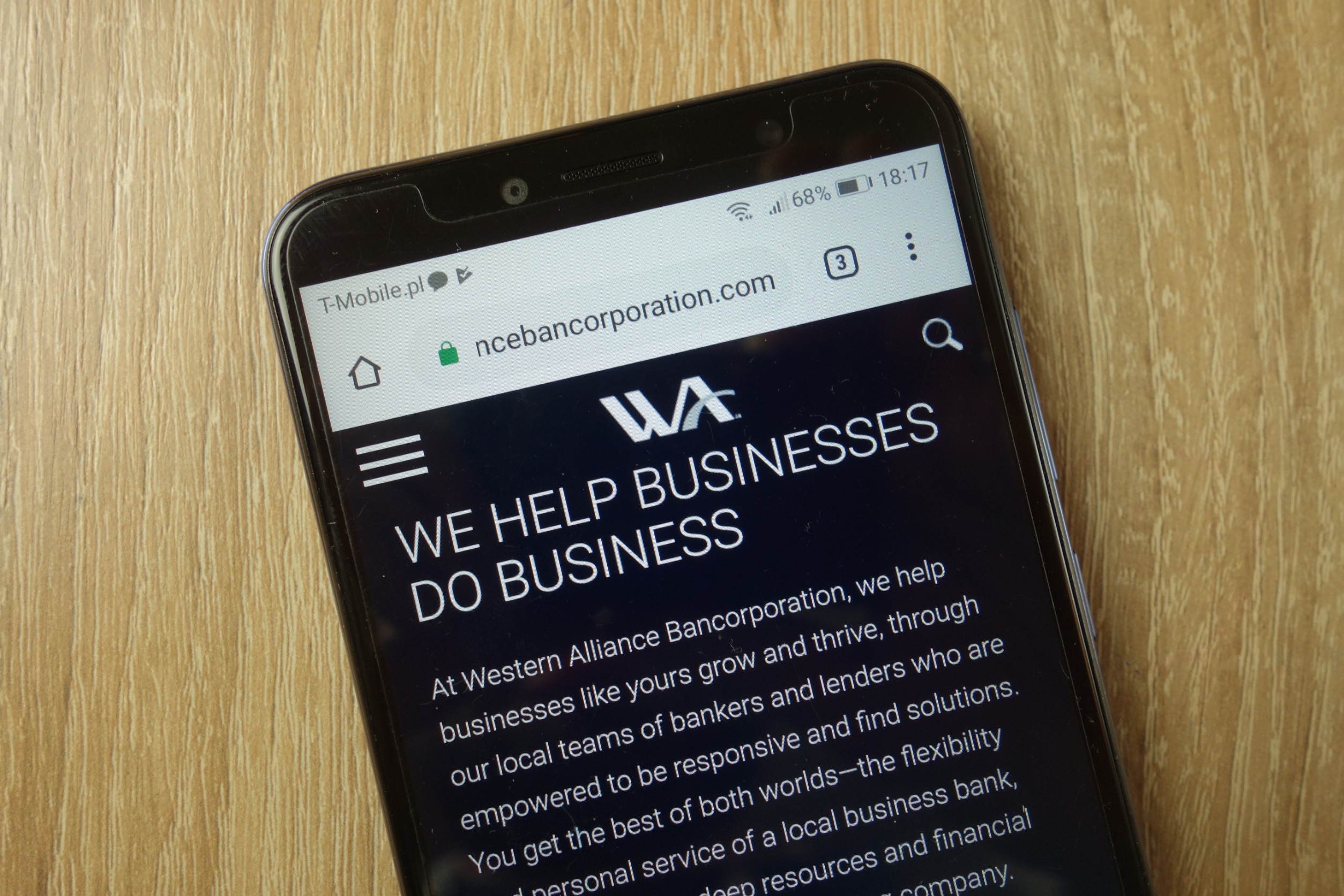 A smartphone displaying a page on Western Alliance's website.