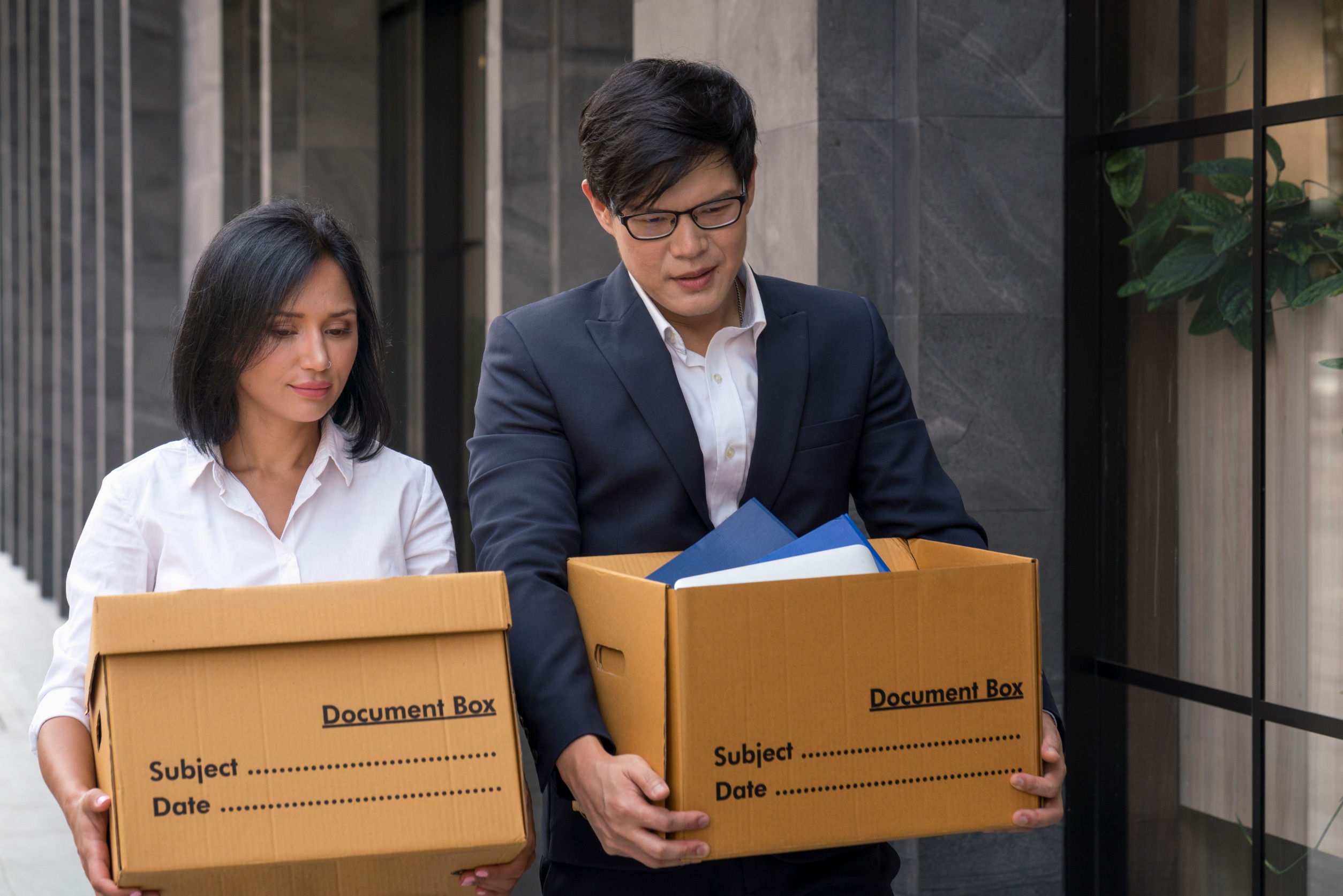 Employees are moving items from offices that were closed due to business problems.