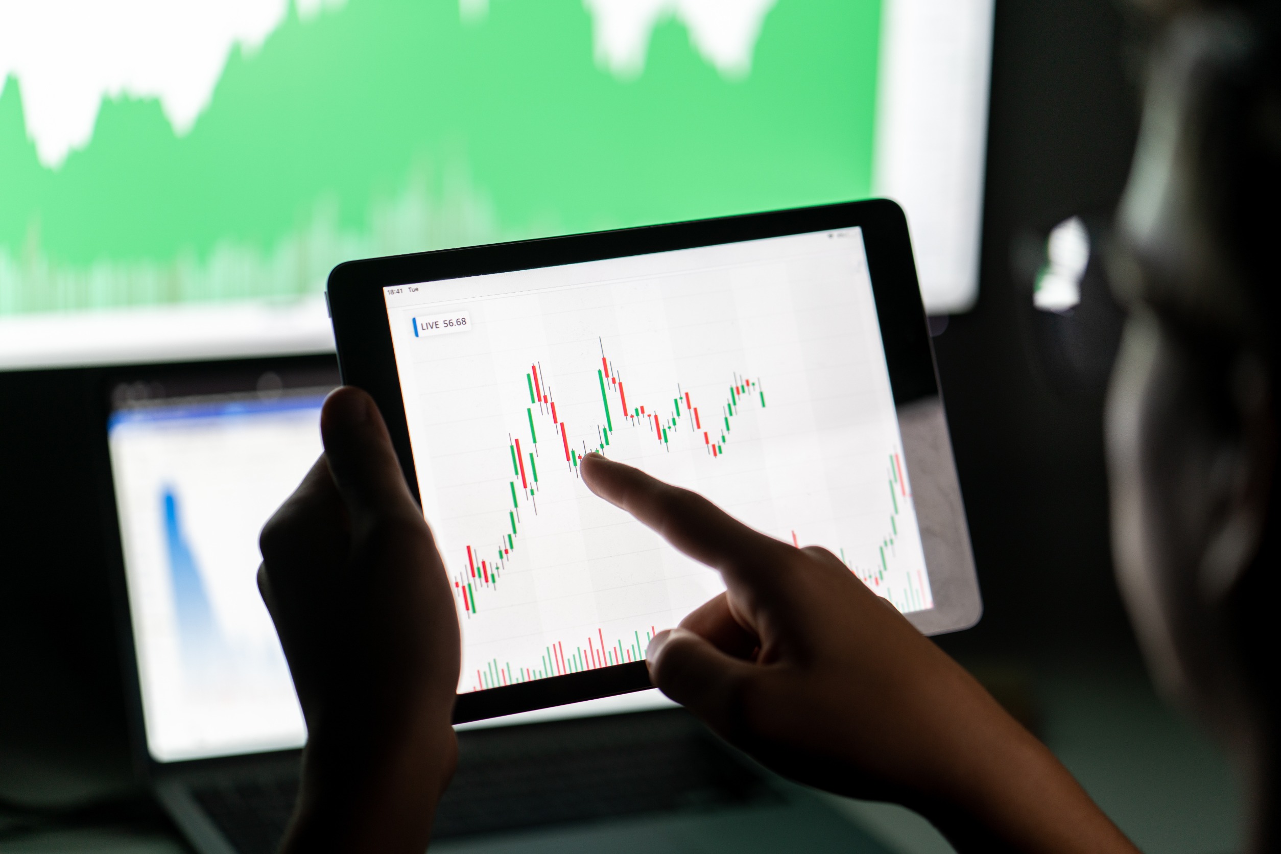 Crypto trader investor analyst looking at computer screen analyzing financial graph data on pc monitor, thinking of online stock exchange market .
