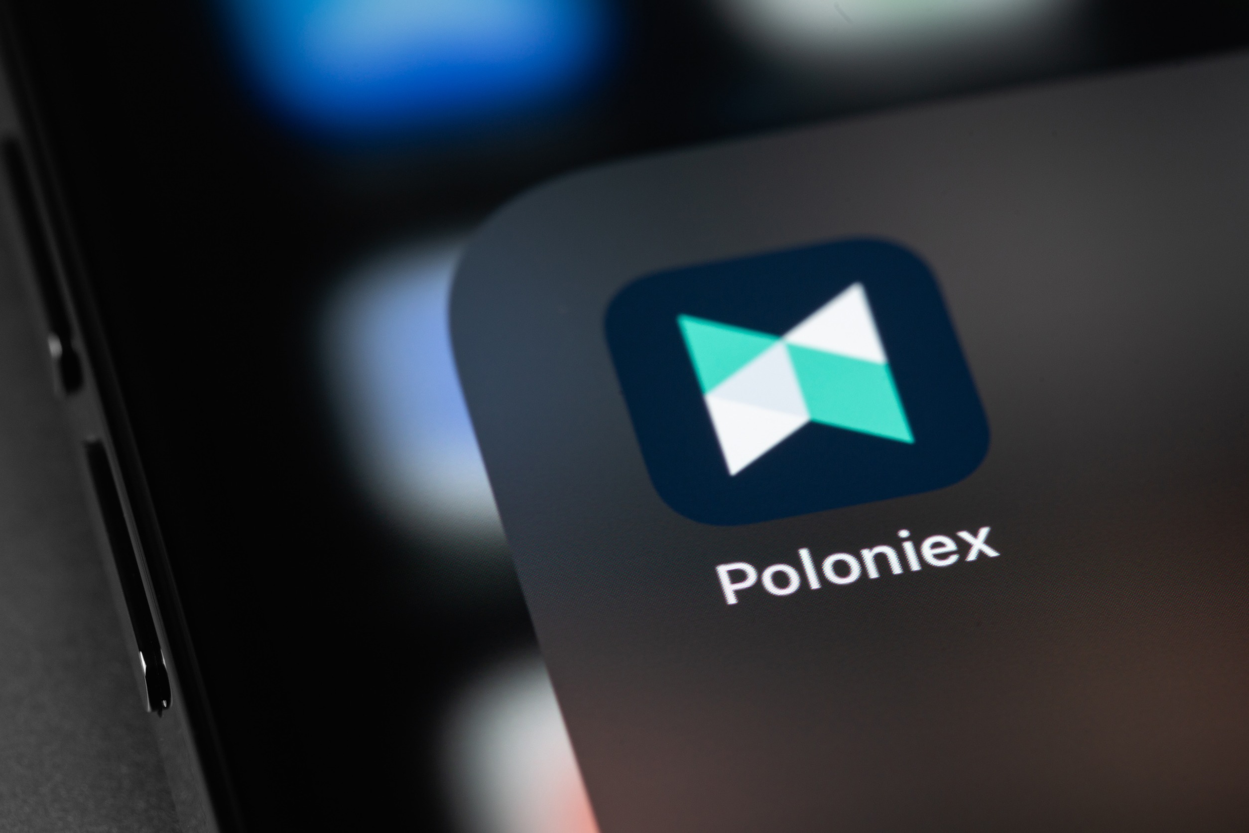 Poloniex app icon on a smartphone screen.