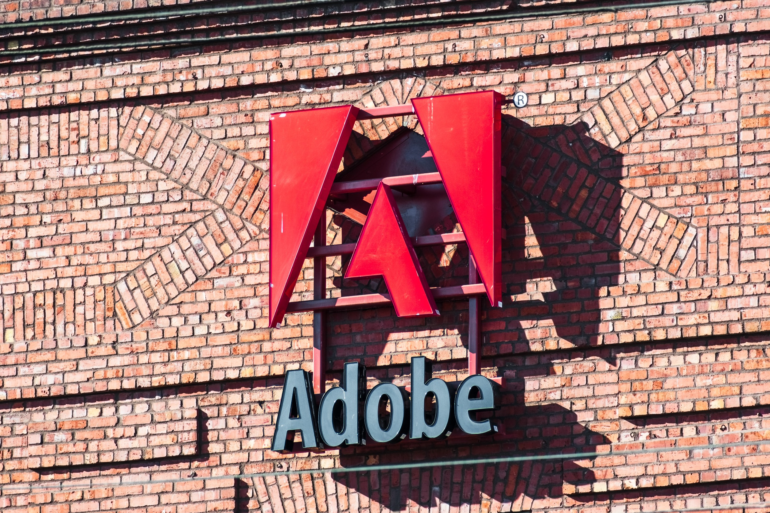 Jefferies Raises Adobe PT to $700, Downplays Weak 2024 Guidance